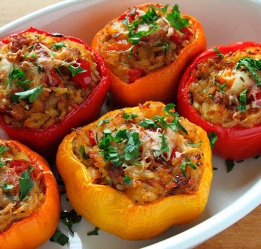 Peppers stuffed with rice and minced meat .